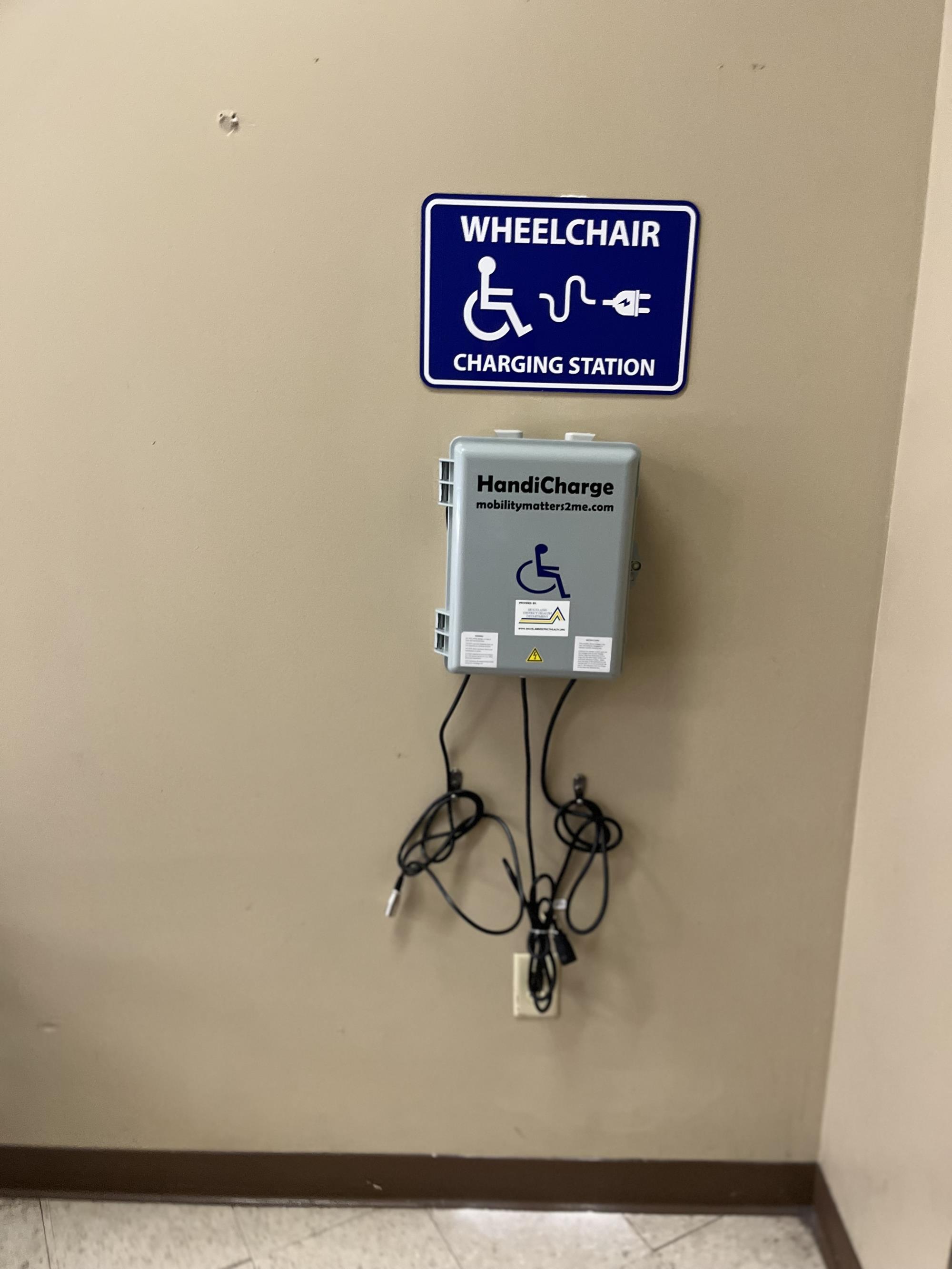 Wheelchair Charging Station hanging on wall